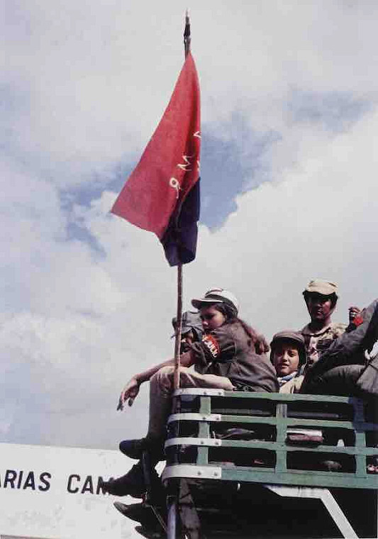 Young Fidelistra on Bus with Flag, 1959
